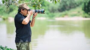 Professional wildlife photography equipment and camera lens for gorilla trekking safari